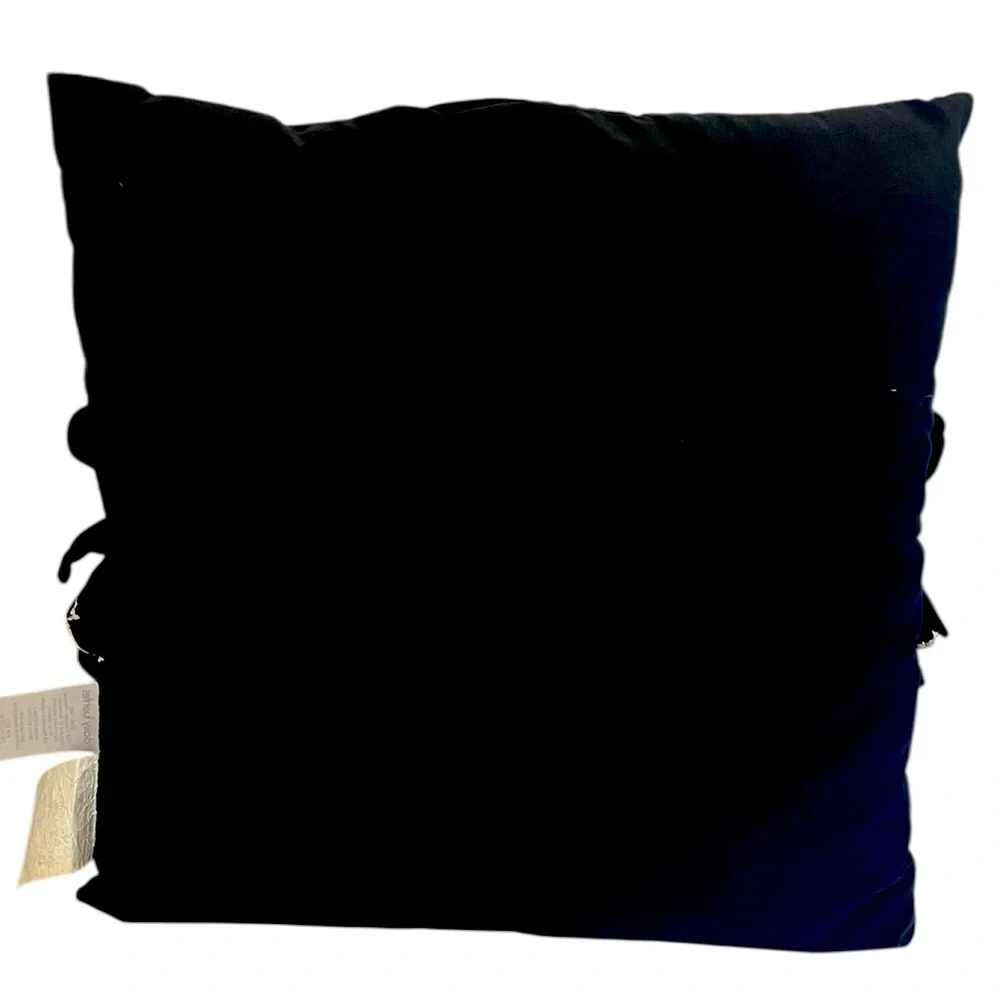 Elegant Black and Cream Ruffled Throw Pillow by Daisy Fuentes.